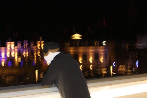 image of music producer at a console