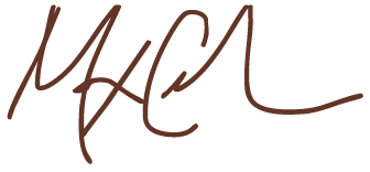 Stylized handwritten signature in brown ink.