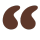 Brown stylized quotation mark symbol.