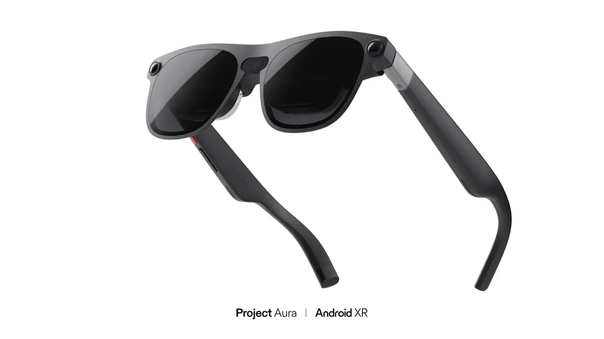 A pair of sleek, dark Project Aura XR glasses by XREAL and Google, featuring a minimalist design with thin frames.