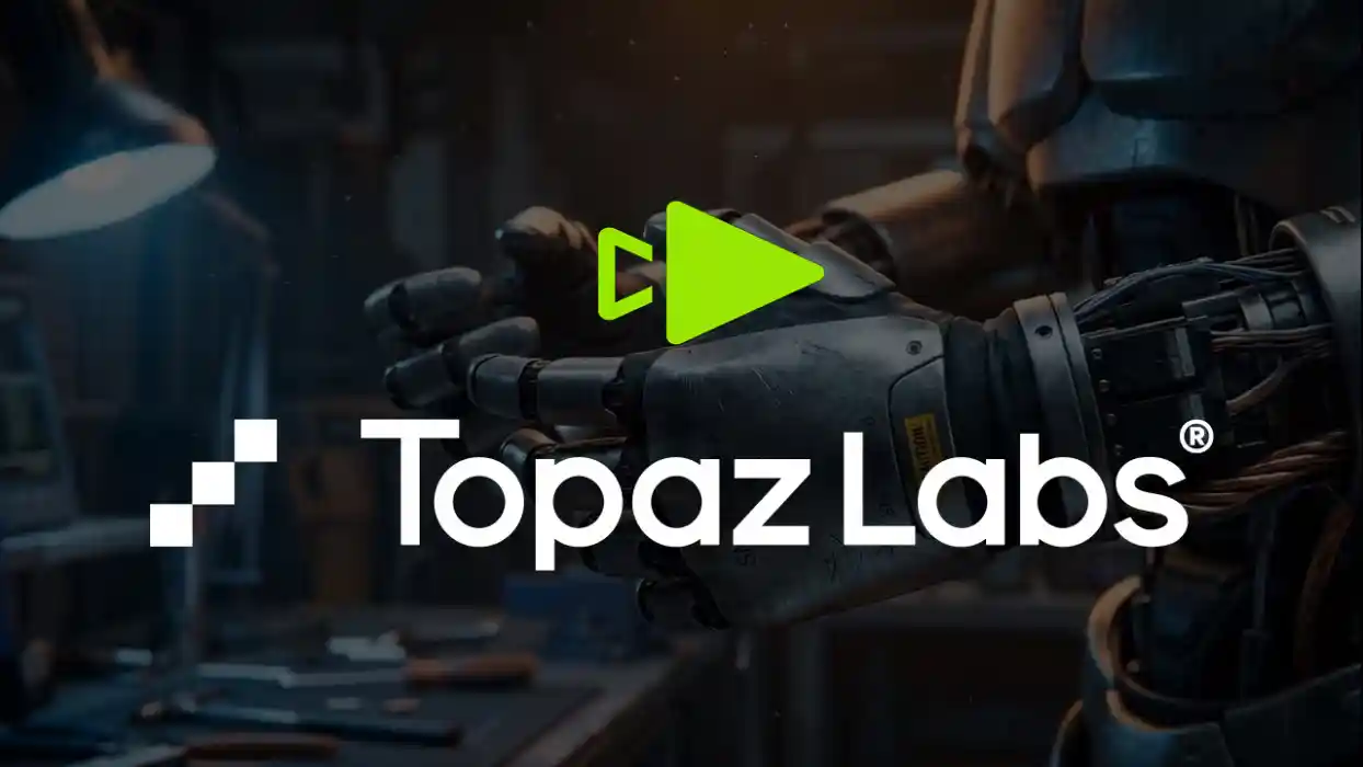 Topaz Labs logo with a green play button icon, set against a dark cinematic background featuring a detailed robotic hand in a workshop environment.