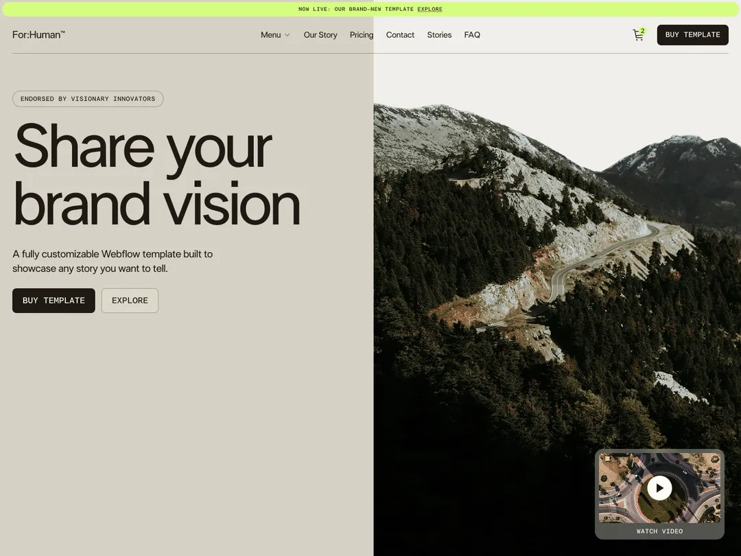 Website homepage split with text 'Share your brand vision' on left and mountain road landscape on right with video play button overlay.