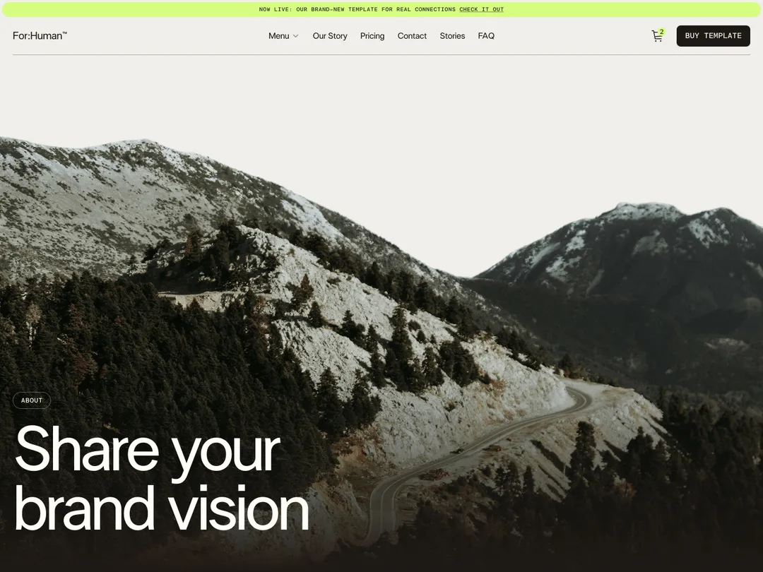 Mountain landscape with a winding road and pine trees under a pale sky, with text 'Share your brand vision'.