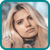 Portrait of a blonde woman smiling outdoors, used as a customer testimonial image for Vegas Auto Loans.