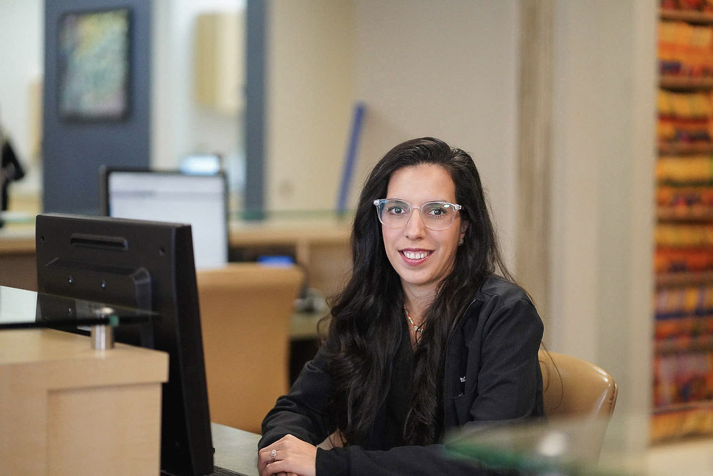 An Ogden Orthodontics team member at the front desk