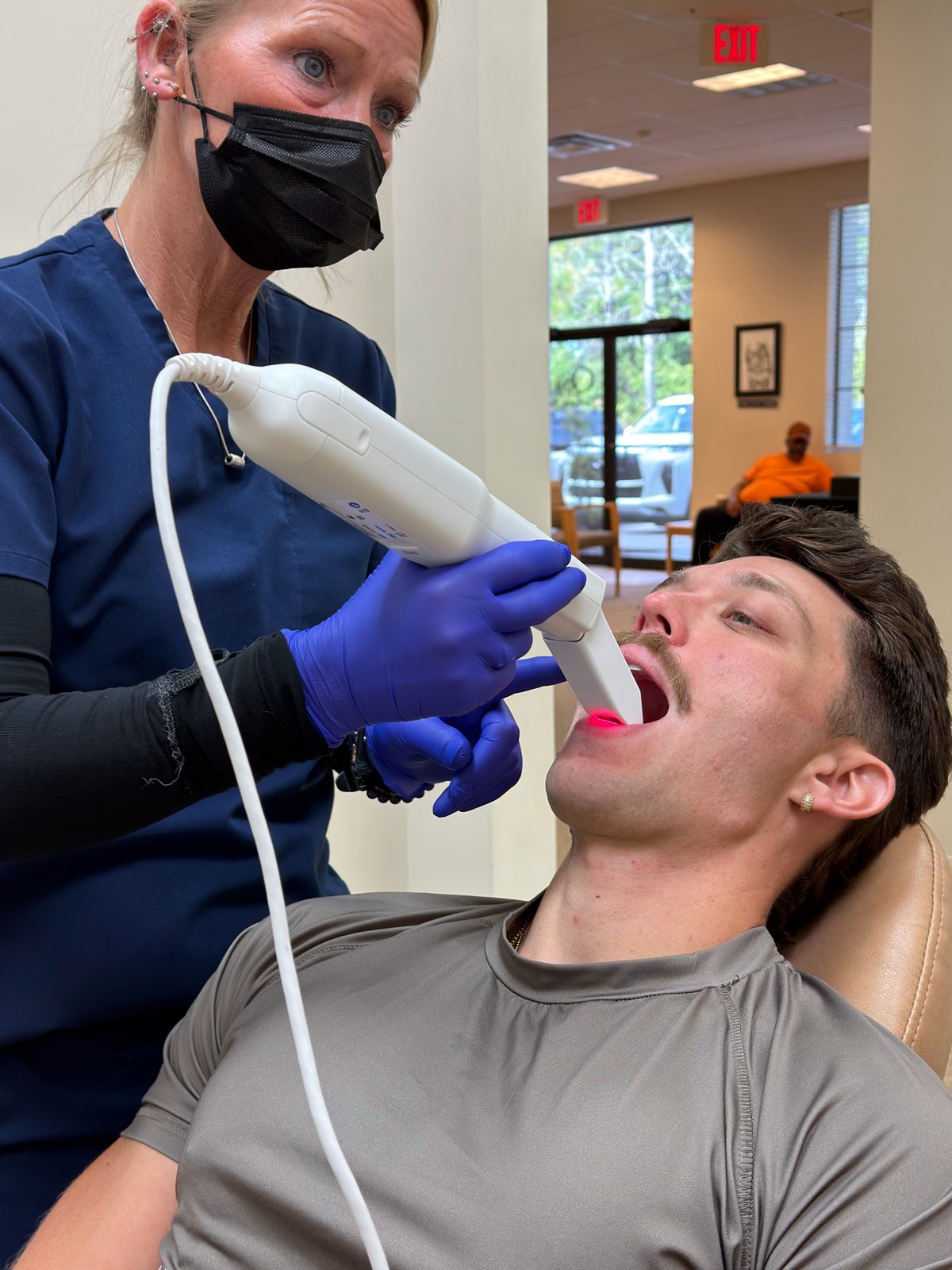 iTero digital scan being taken for an adult Invisalign patient at Ogden Orthodontics