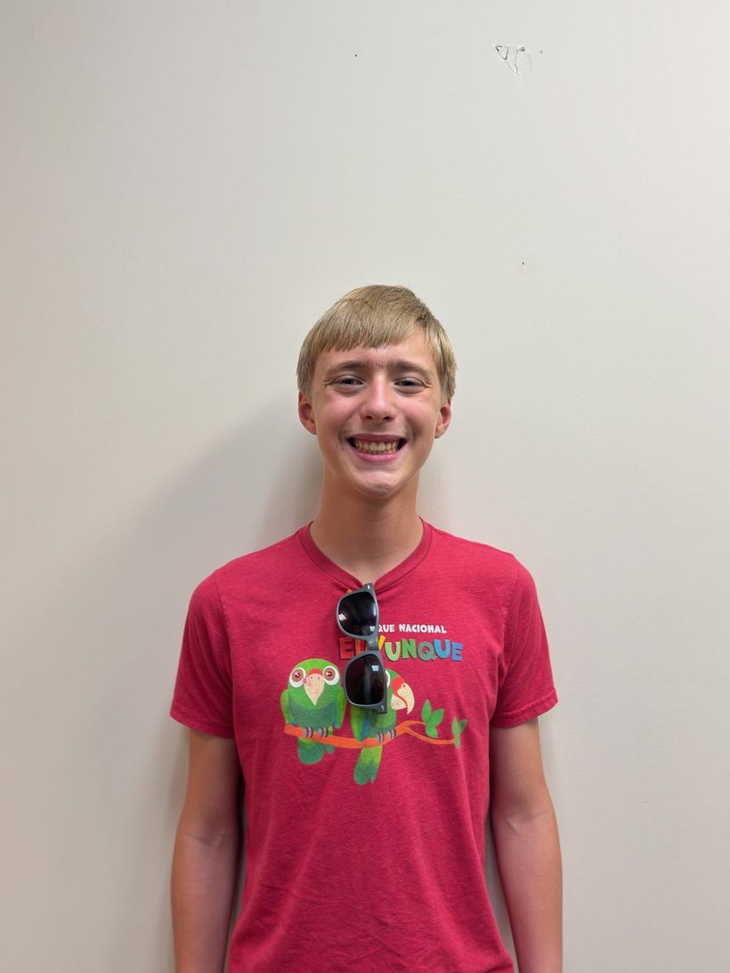 Teen patient smiling after having his braces removed at Ogden Orthodontics