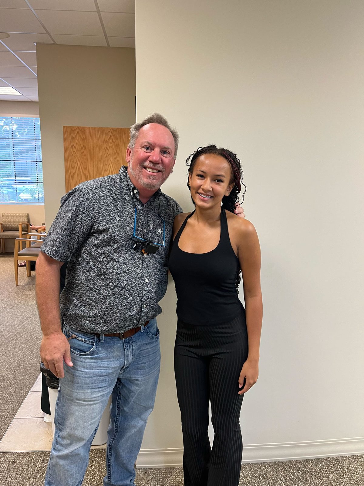 Dr. Robert Ogden with a patient wearing braces at Ogden Orthodontics