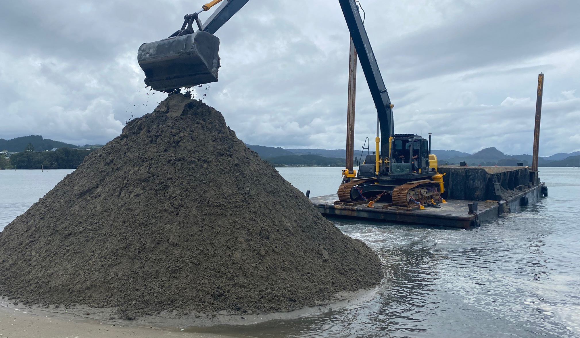 Long-reach excavator mounted on a digger barge