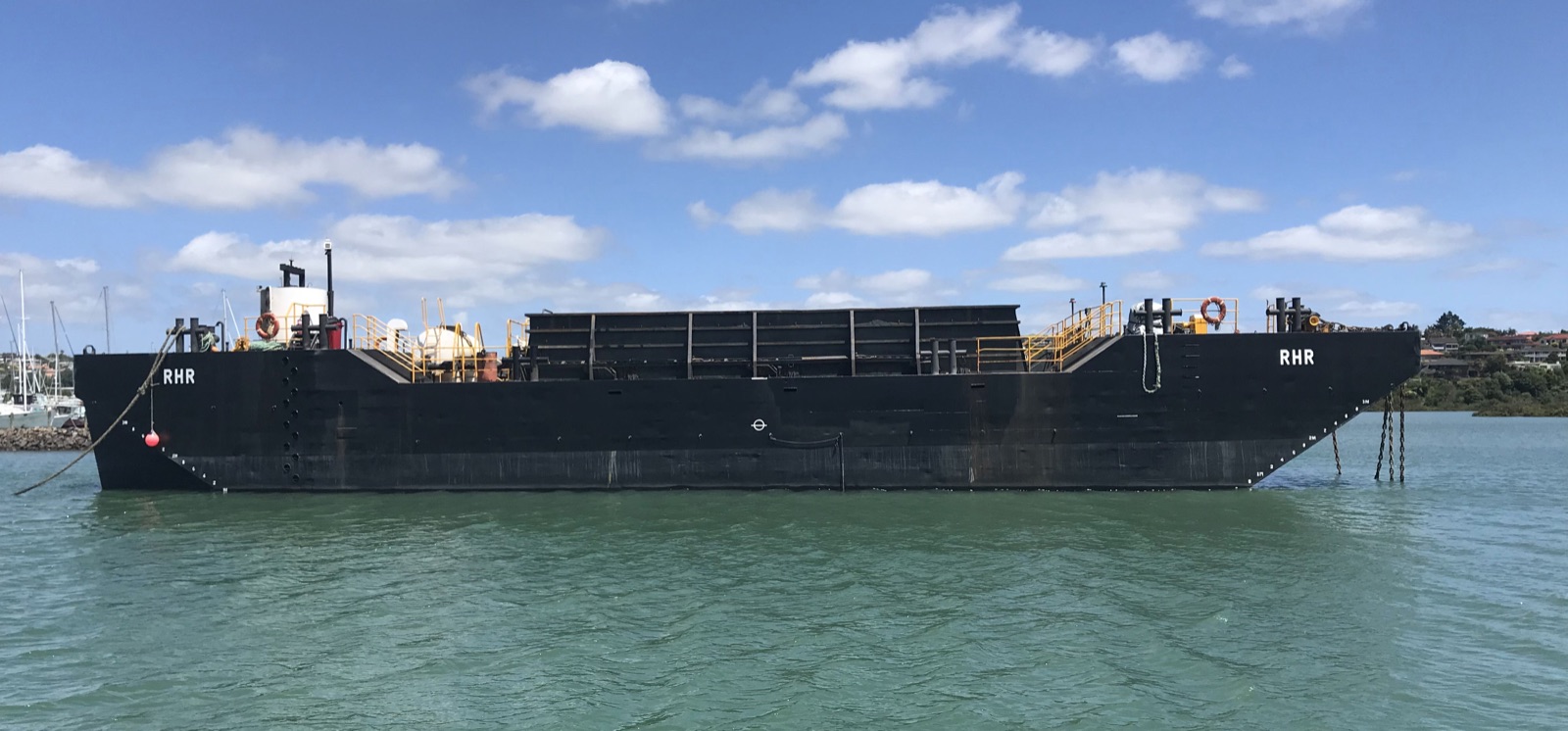 The RHR bottom dump barge alongside