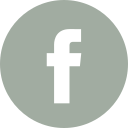 Facebook logo in black inside a gray circle.