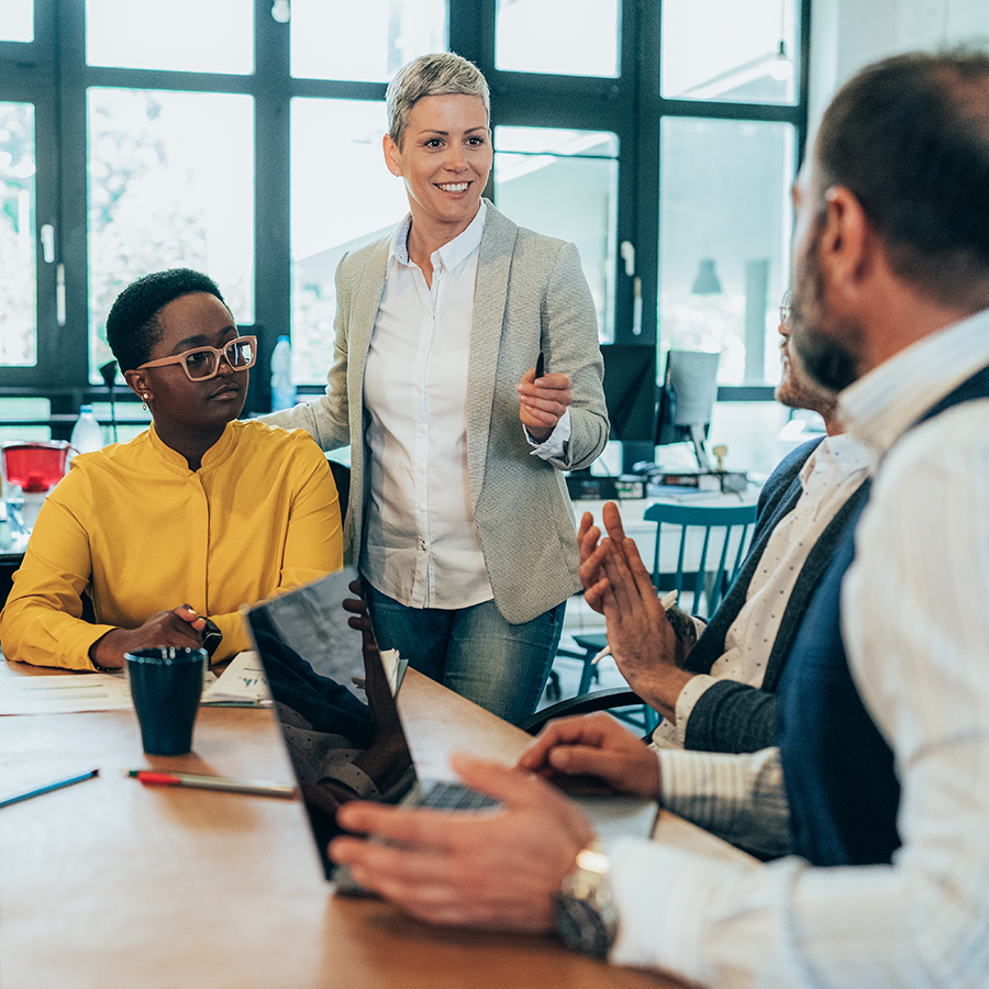 Group of professionals seated around a table during a workplace training discussion