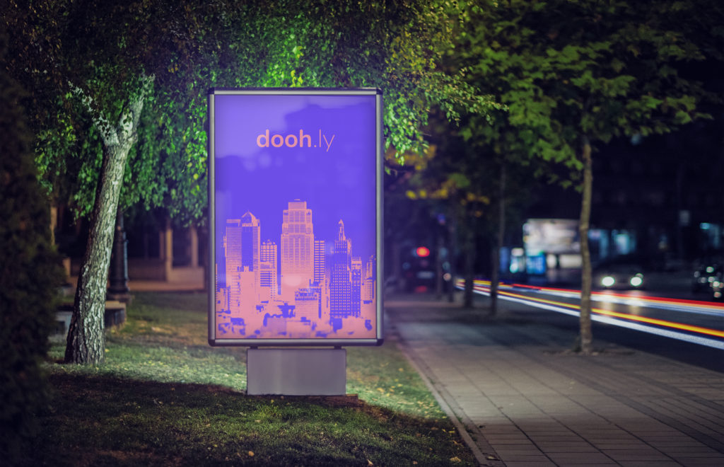 Doohly digital signage at night in park