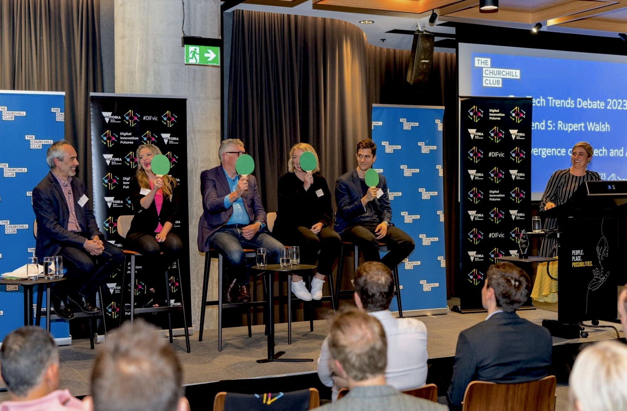 Vibrant business event panel discussion moderated by MC