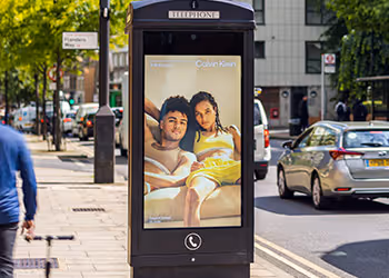 Adshel Live panel featuring a man and women in the advert