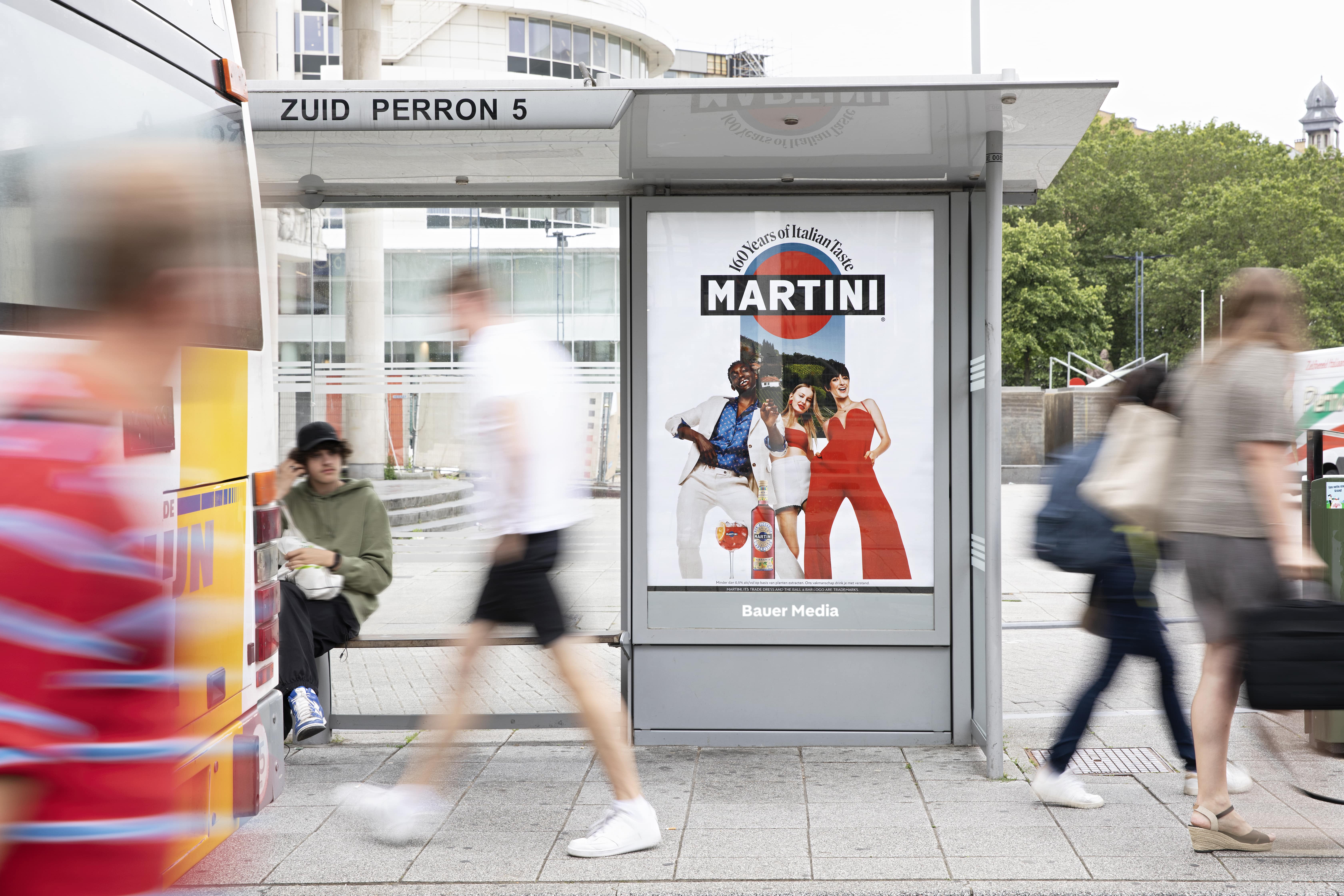 Digital advertisement in the middle of a busy high street