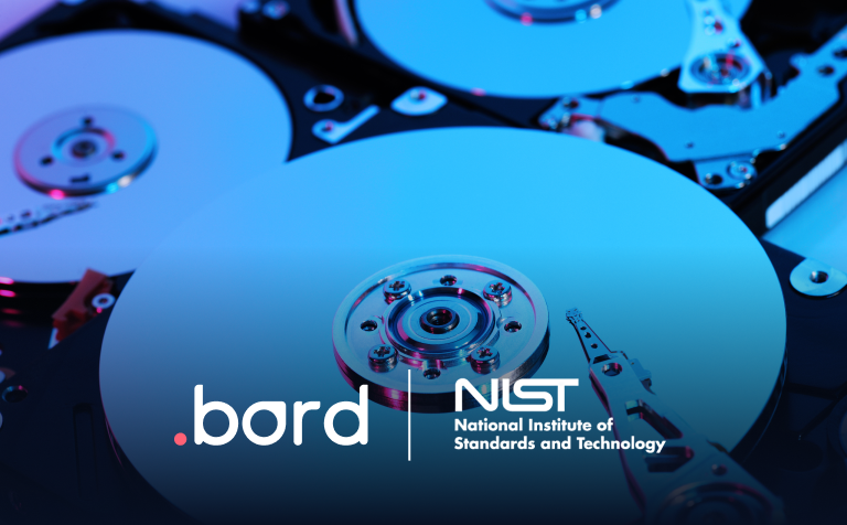 Open hard drives with exposed platters under blue light. .bord and NIST logos