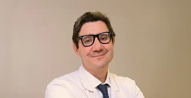 Portrait of a medical researcher smiling, thumbnail for the ePRO tools in early-phase clinical trials article