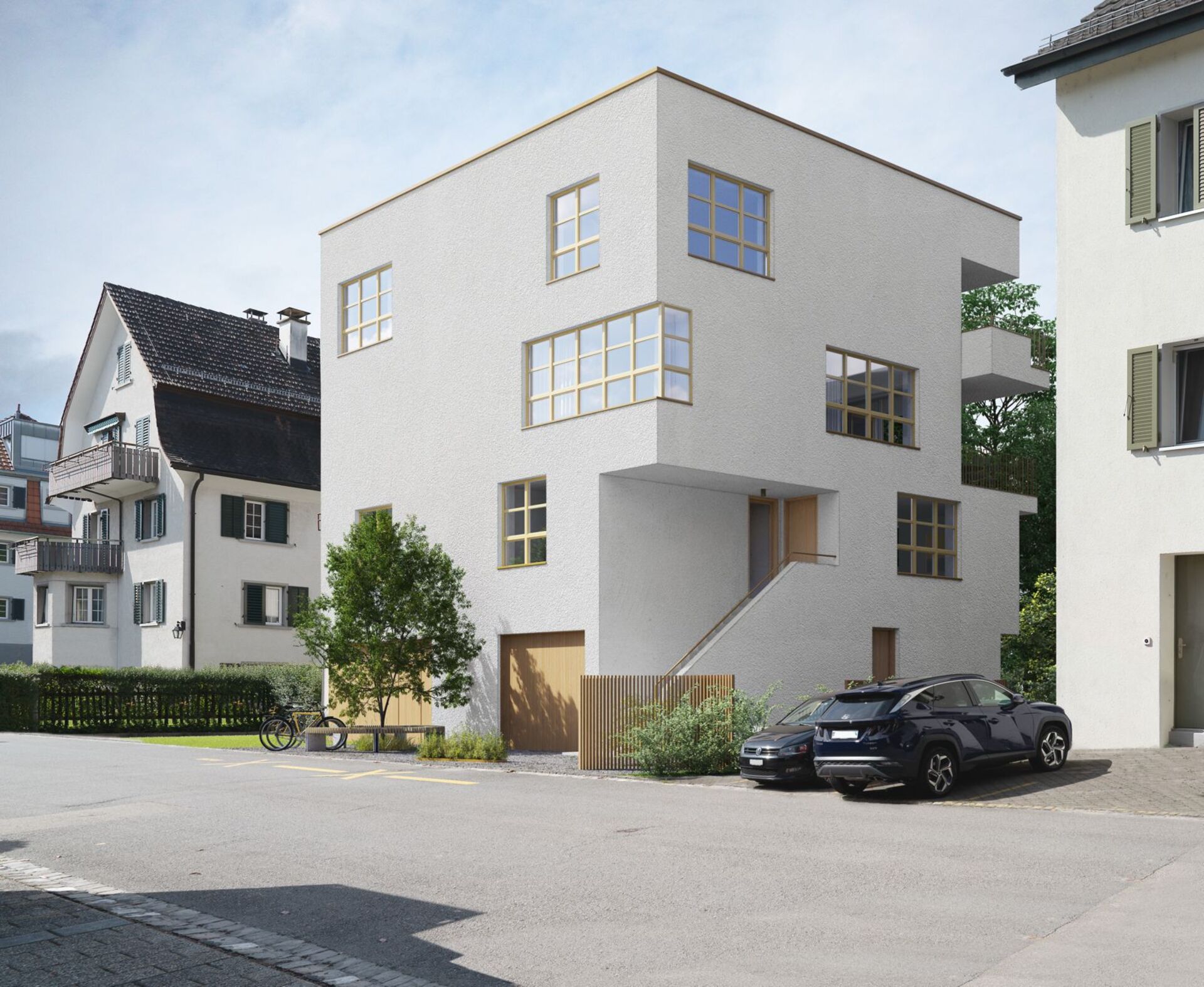 Modern white cubic house with large wooden framed windows, a garage, exterior stairs, a tree and two parked cars in a suburban street.