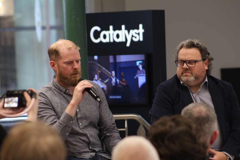 Martin Naughton speaking beside another panellist at Catalyst.