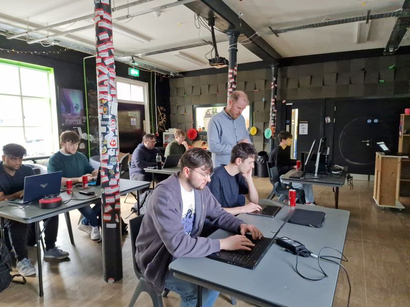 Martin Naughton leading a session with students working at laptops at Farset Labs.