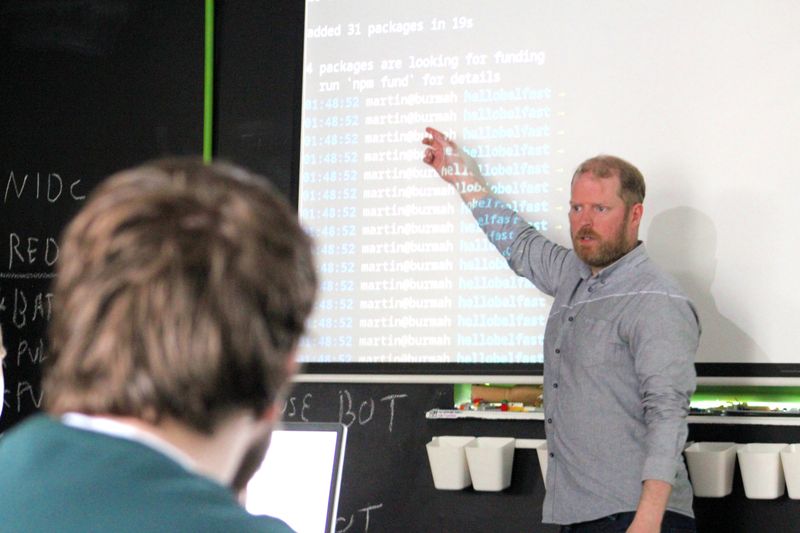 Martin Naughton pointing to projected code during Pizza and Programming.