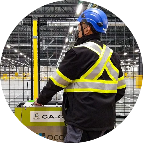 a man wearing a safety vest and helmet