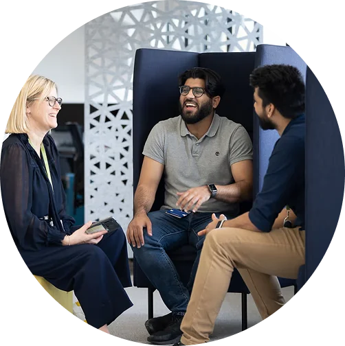 a group of people sitting in chairs