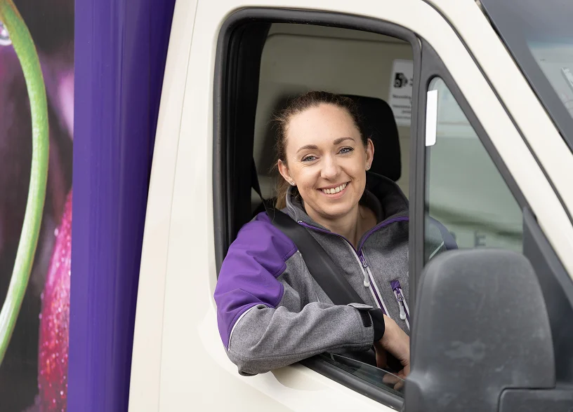 a woman sitting in a truck
