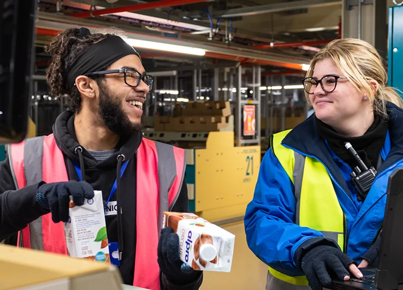 a man and woman in reflective vests