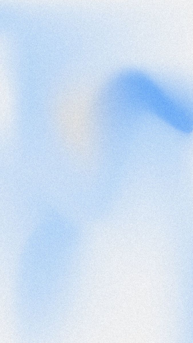 Blurred background with soft blue and white gradient tones creating an abstract, out-of-focus effect.
