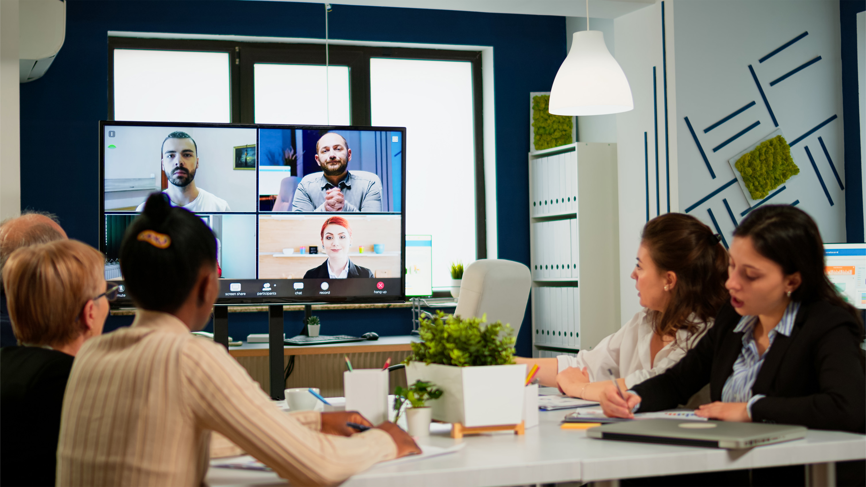 Emplyees workers having webcam conference with coworkers speaking on video call