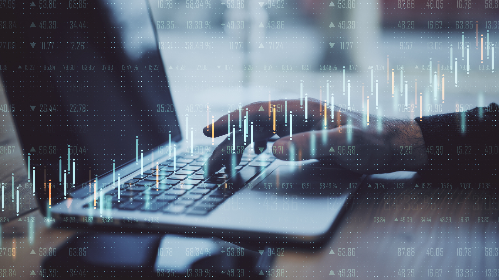 candlestick charts over a computer