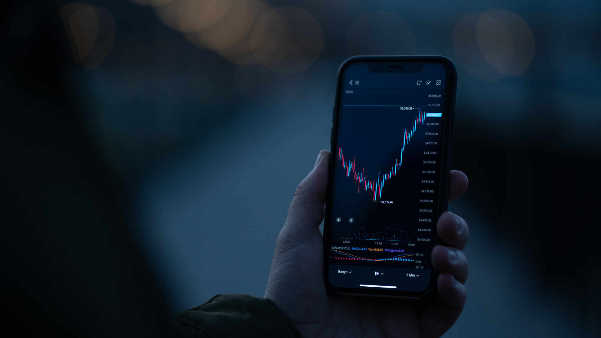 Phone with candlestick chart