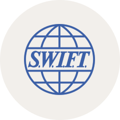 SWIFT logo featuring a blue globe with latitude and longitude lines behind the acronym S.W.I.F.T.