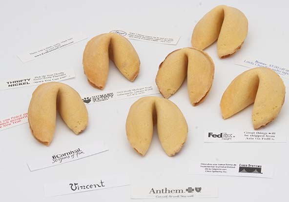 Under gold foil lays a surprise business card.