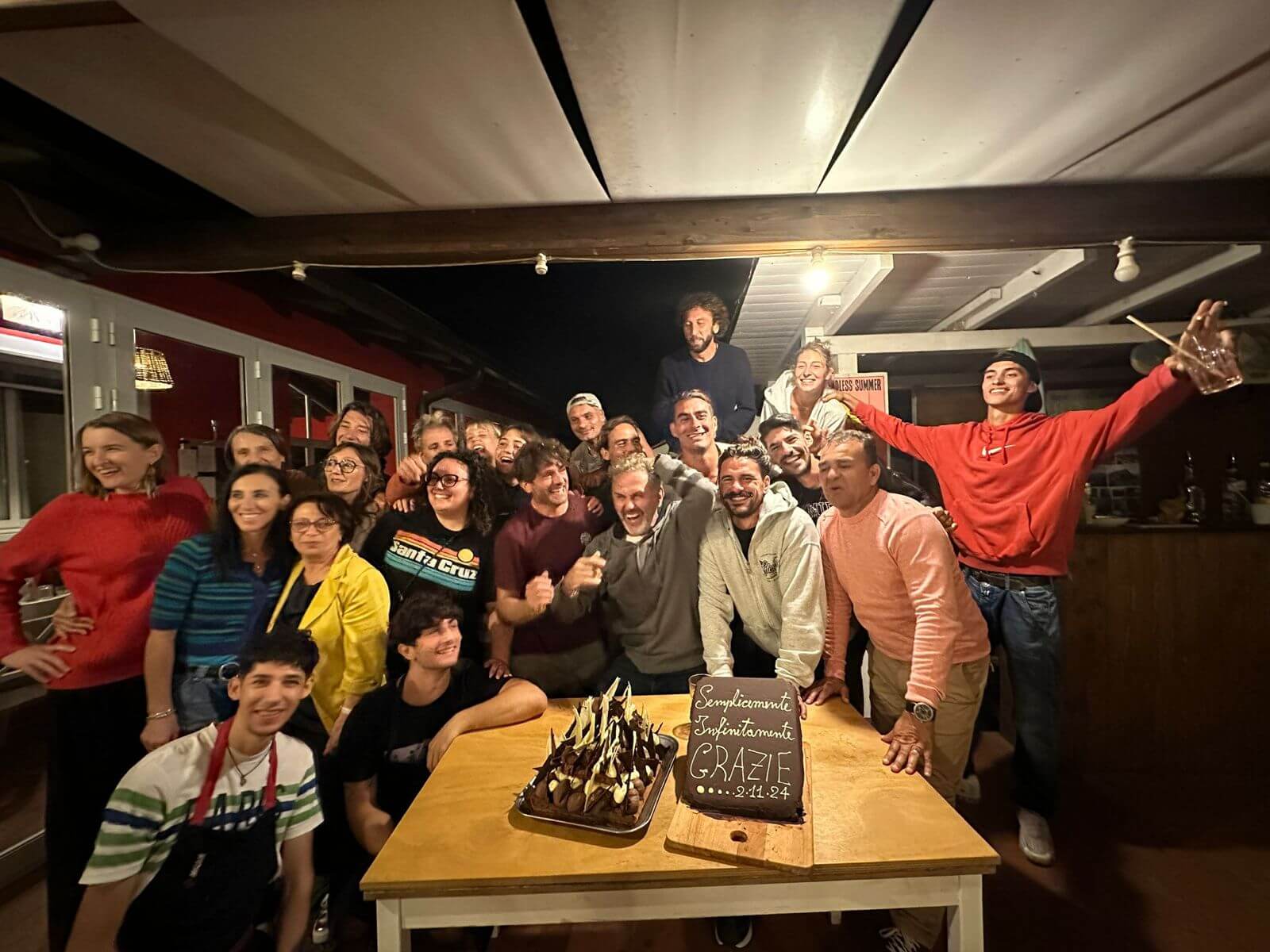 Floripa Surf and Yoga House team celebrating together in Sicily, showing the retreat’s strong community, joyful spirit, and welcoming staff