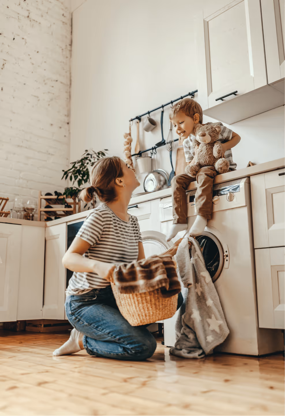 a woman and a child in a laundry room