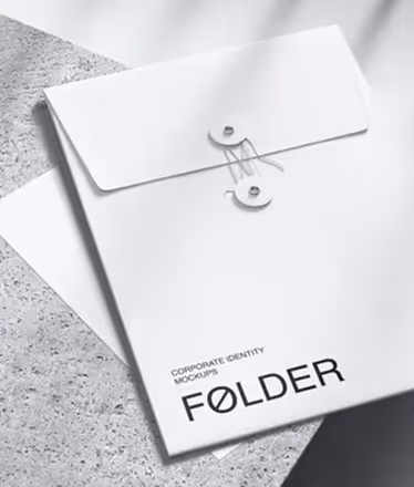White corporate identity folder with string-and-button closure on a textured surface.
