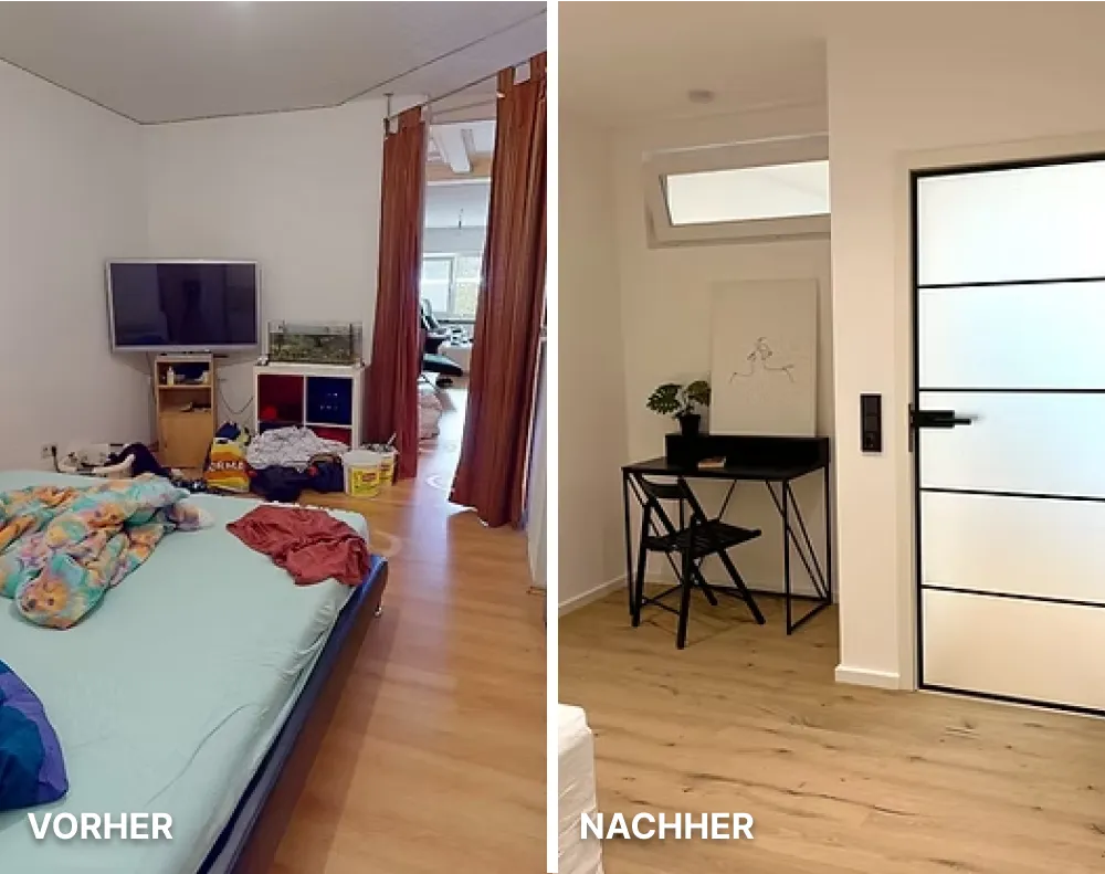 Moderne helle Küche mit weißen Schränken, Holzarbeitsplatte, Kochfeld und großer Fensterfront mit Blick auf Nachbarhäuser.