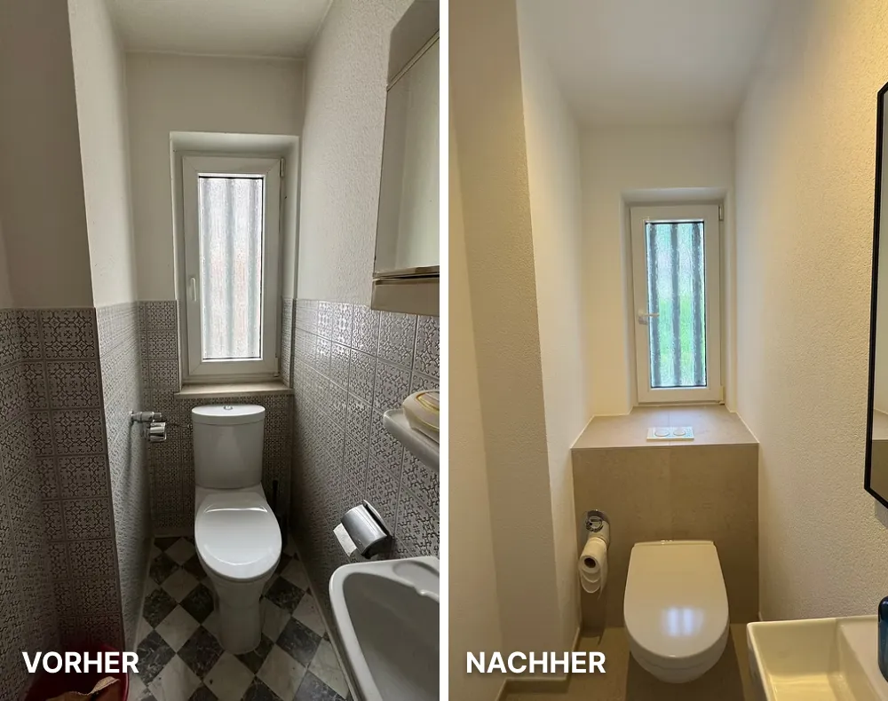 Modernes Badezimmer mit hellen Fliesen, einer begehbaren Dusche mit Glaswand, schwarzer Armatur und ovalem Waschbecken auf Holzarbeitsplatte.
