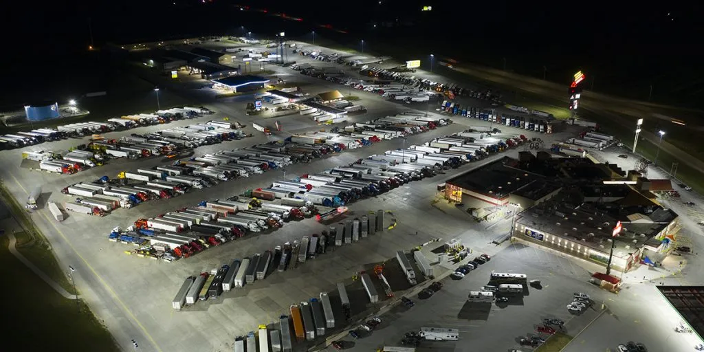 Aerial nighttime view of truck parking on I-10 freight corridor