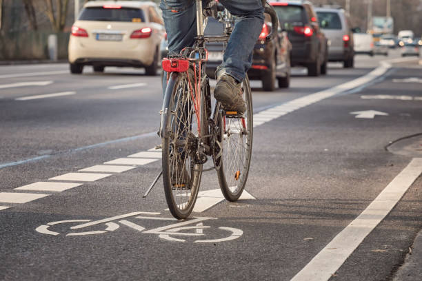Cyclist riding on a city street, bicycle safety monitoring