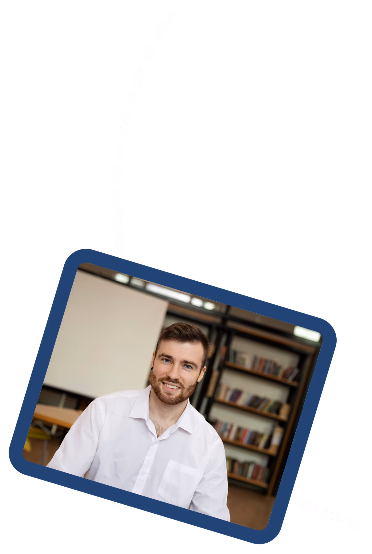 This image shows a tilted photo of a smiling young man with a beard wearing a white shirt, positioned against a dark navy blue background with a white dashed line design element running diagonally across the composition.