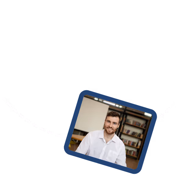 This image shows a tilted photo of a smiling young man with a beard wearing a white shirt, positioned against a dark navy blue background with a white dashed line design element running diagonally across the composition.