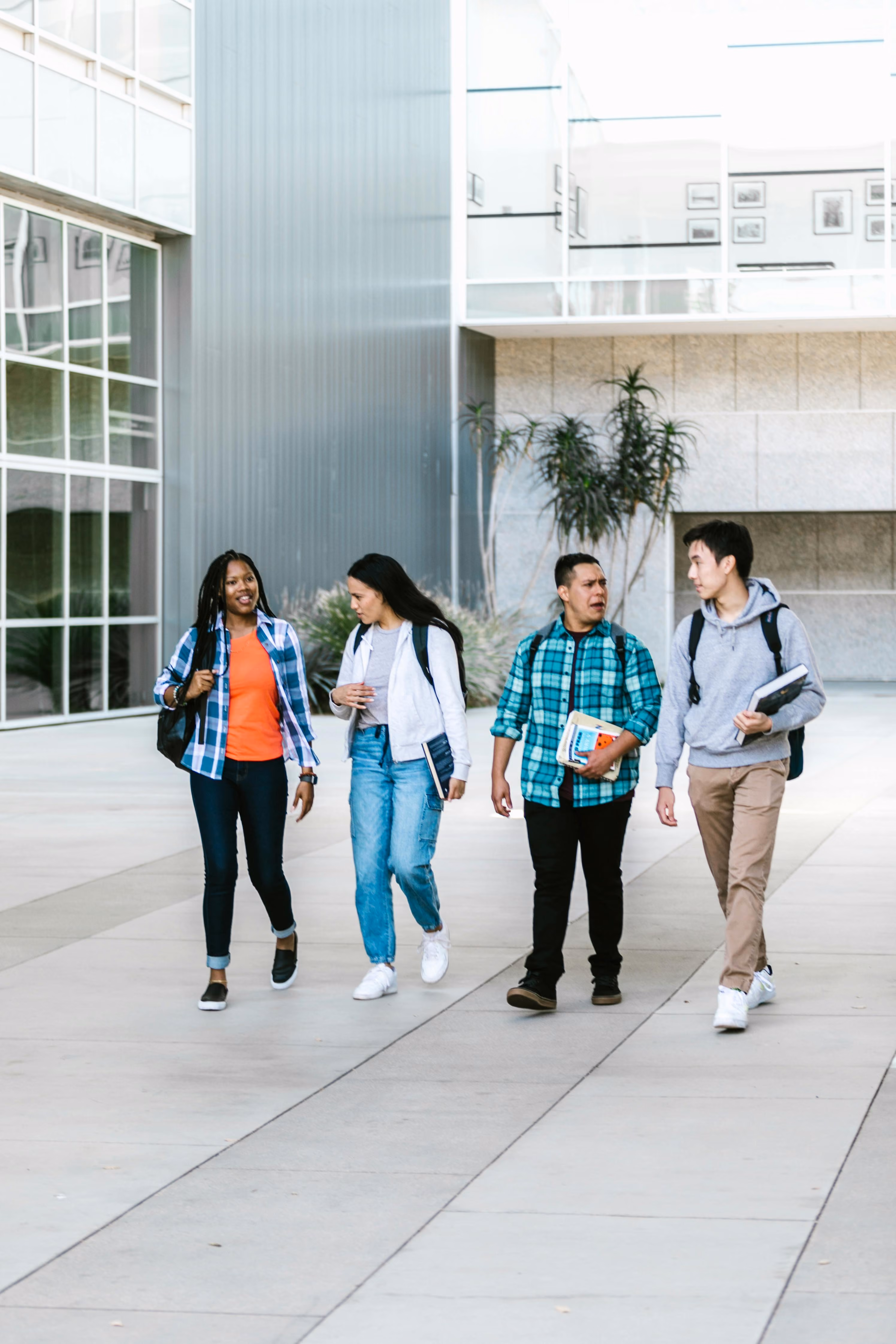 A student walking toward a university building