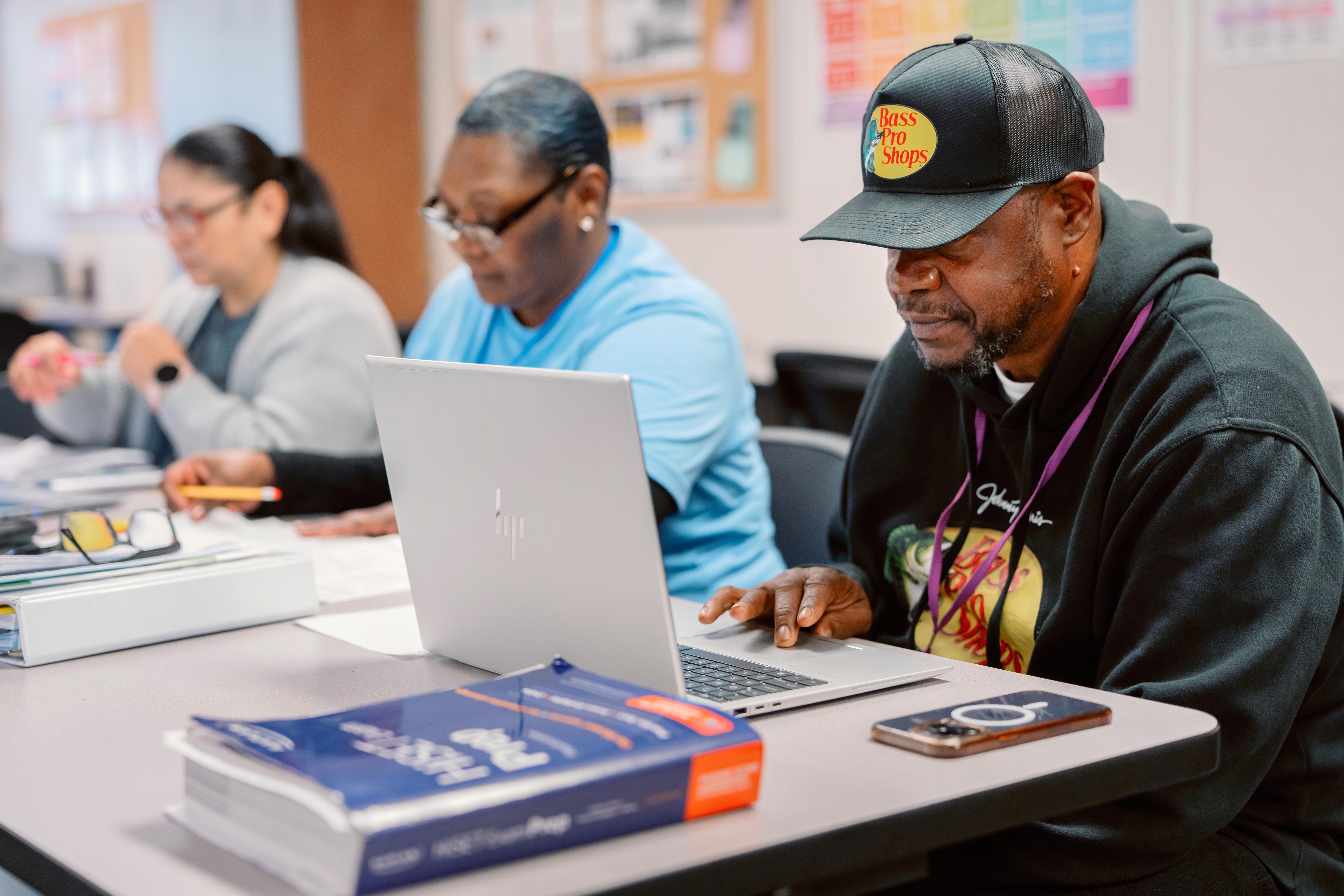 Adult learner planning education and career goals while balancing work and everyday responsibilities