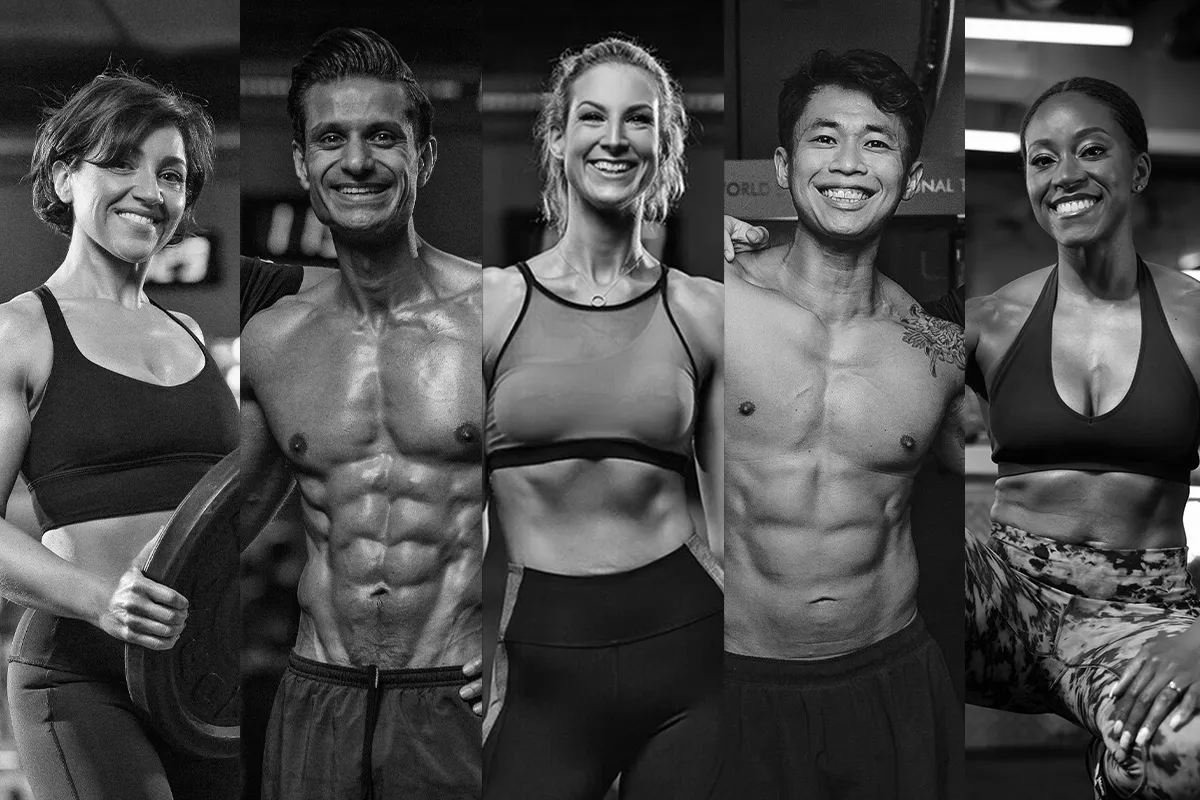 Five fit and smiling men and women posing in workout clothes at the gym.