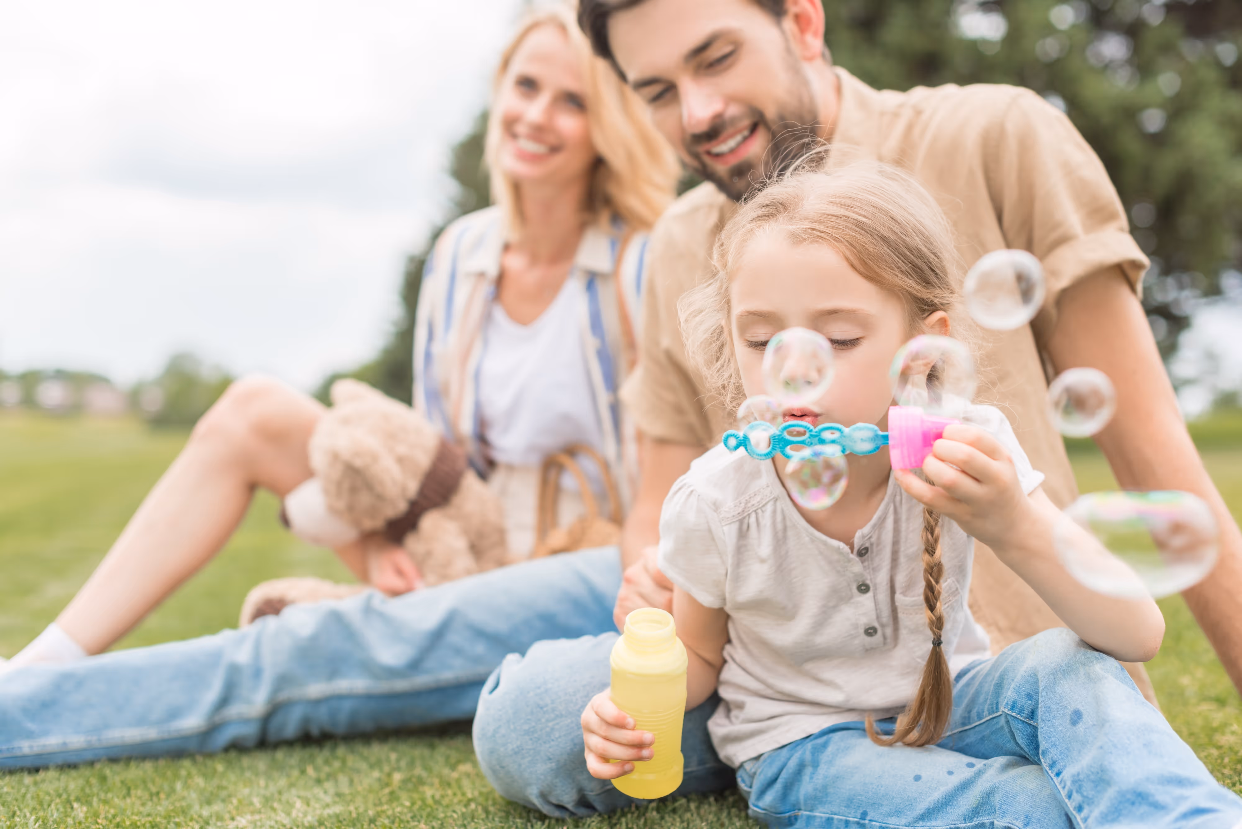 Family Blowing Bubbles Stock Photo