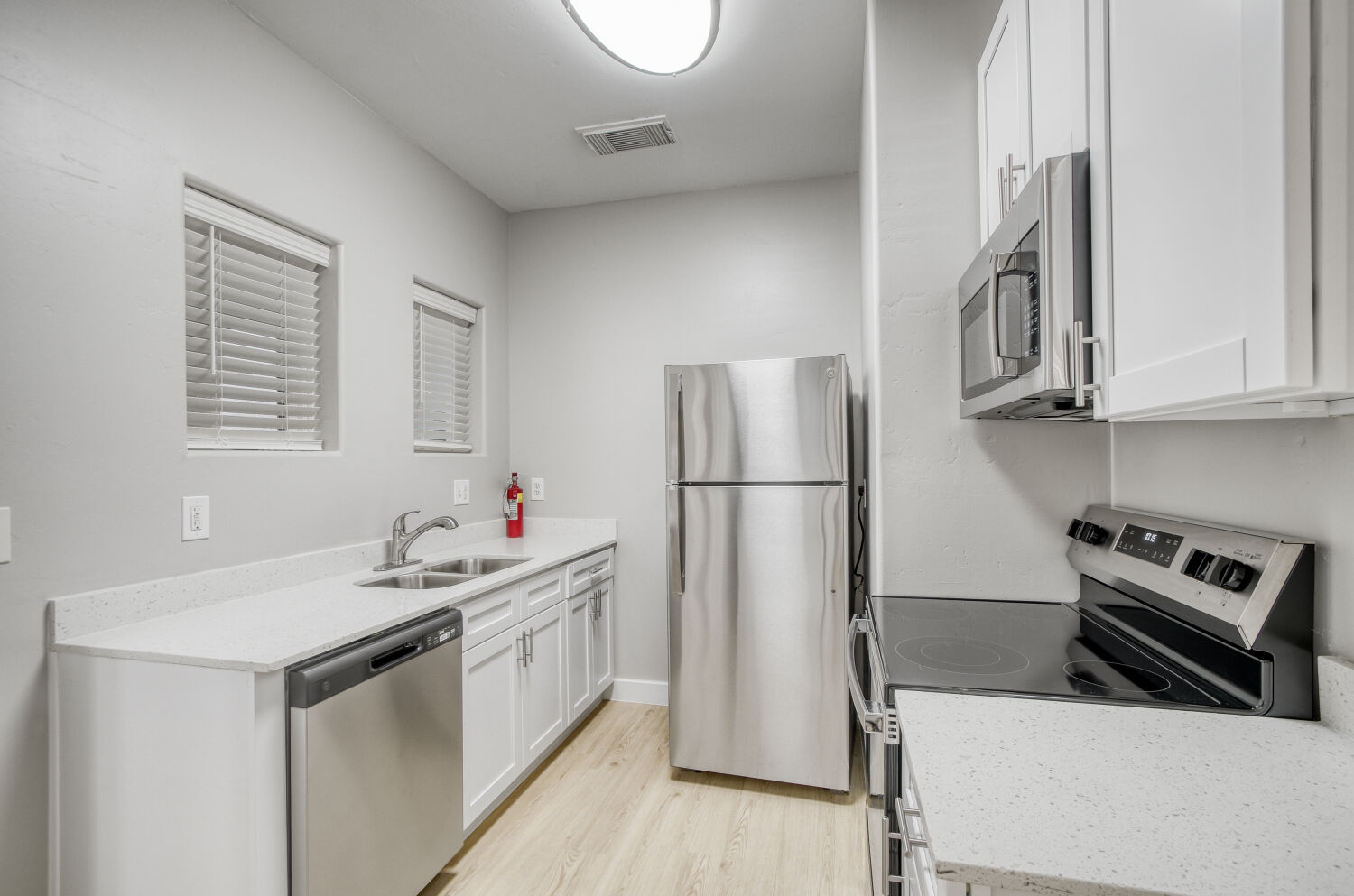 Kitchen with white cabinets and stainless steel appliances